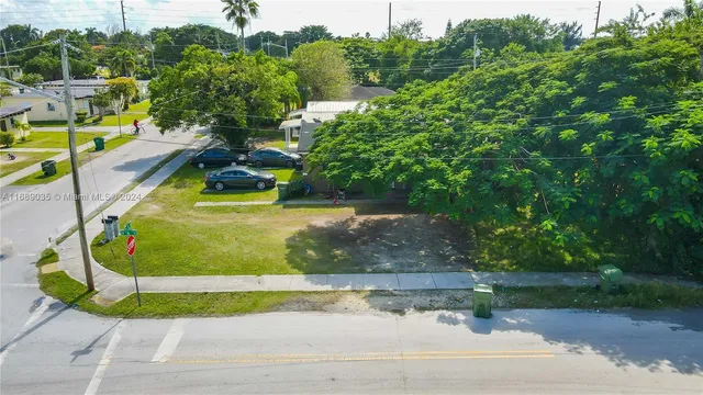a view of a swimming pool with a yard