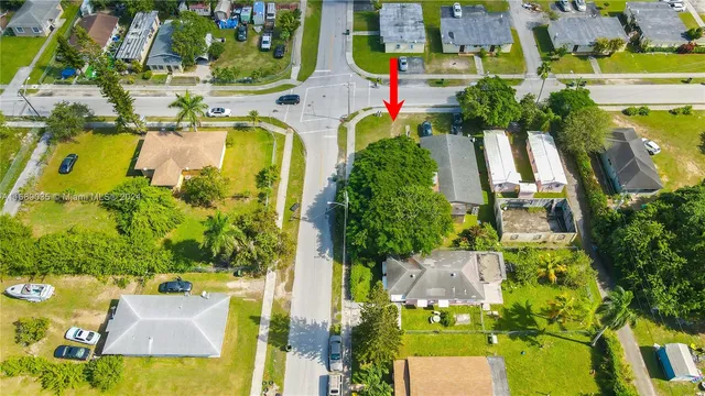 an aerial view of residential houses with swimming pool