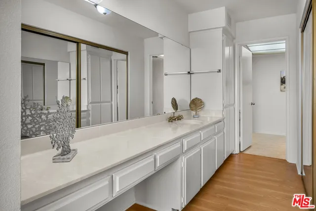 a bathroom with a double vanity sink and mirror