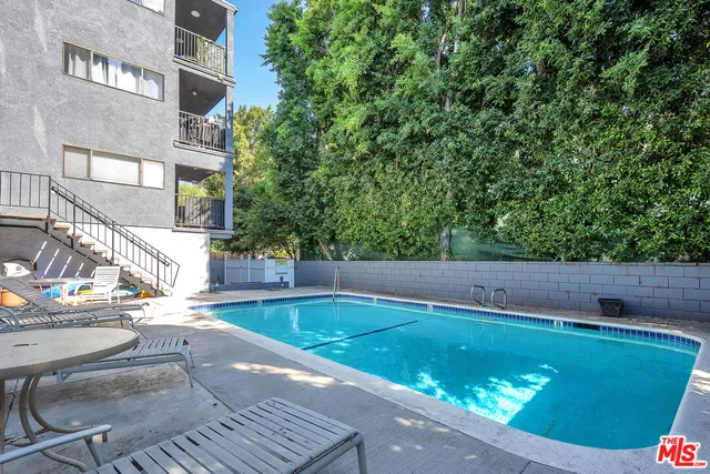 a view of a two chairs and a small yard