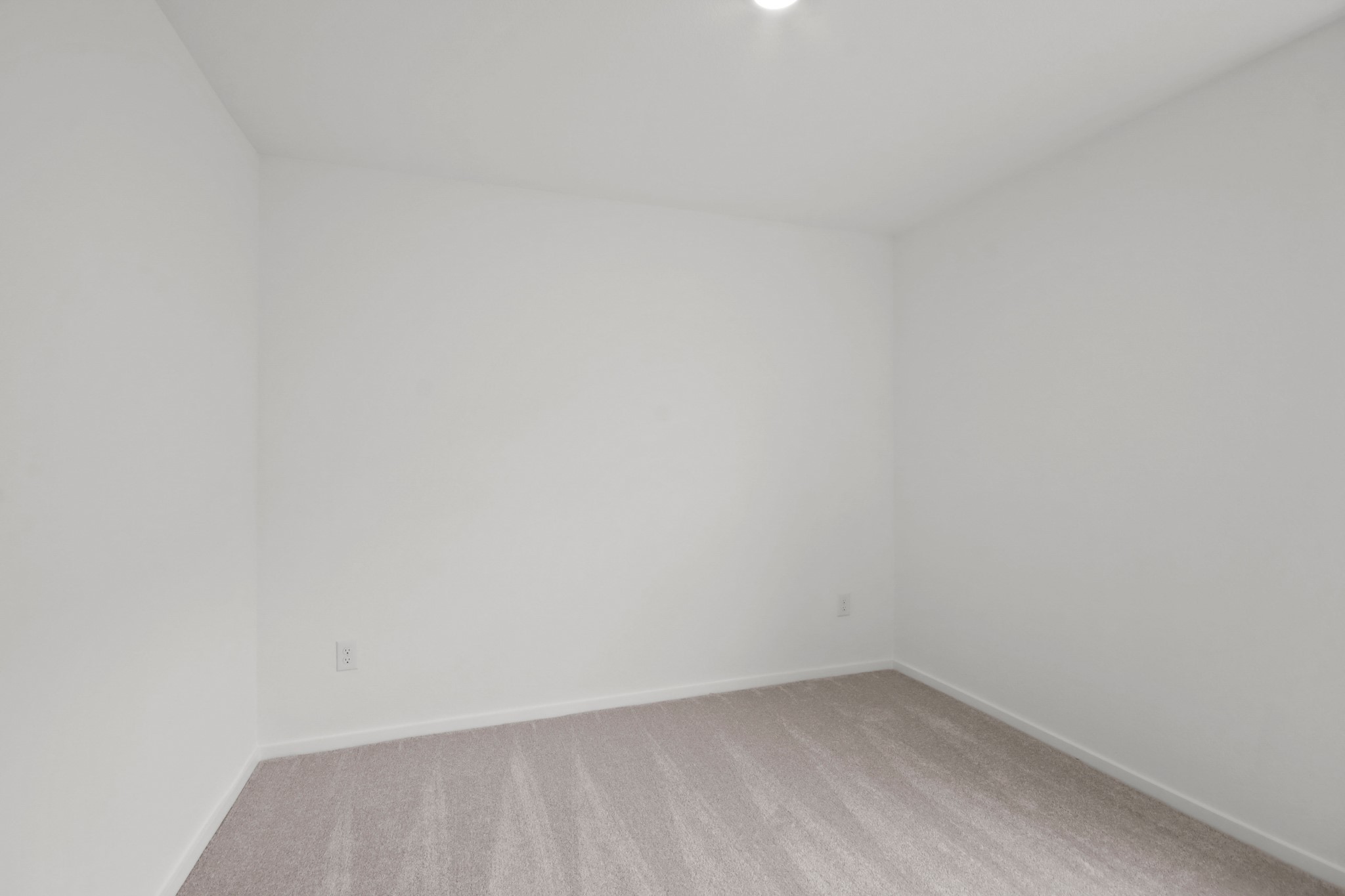 18779 Ribolla Drive New Caney, TX 77357 - Photo 19 of 24 This room with white walls and a light carpet, is suitable for use as a bedroom or office space. The room is well-lit with a ceiling light.