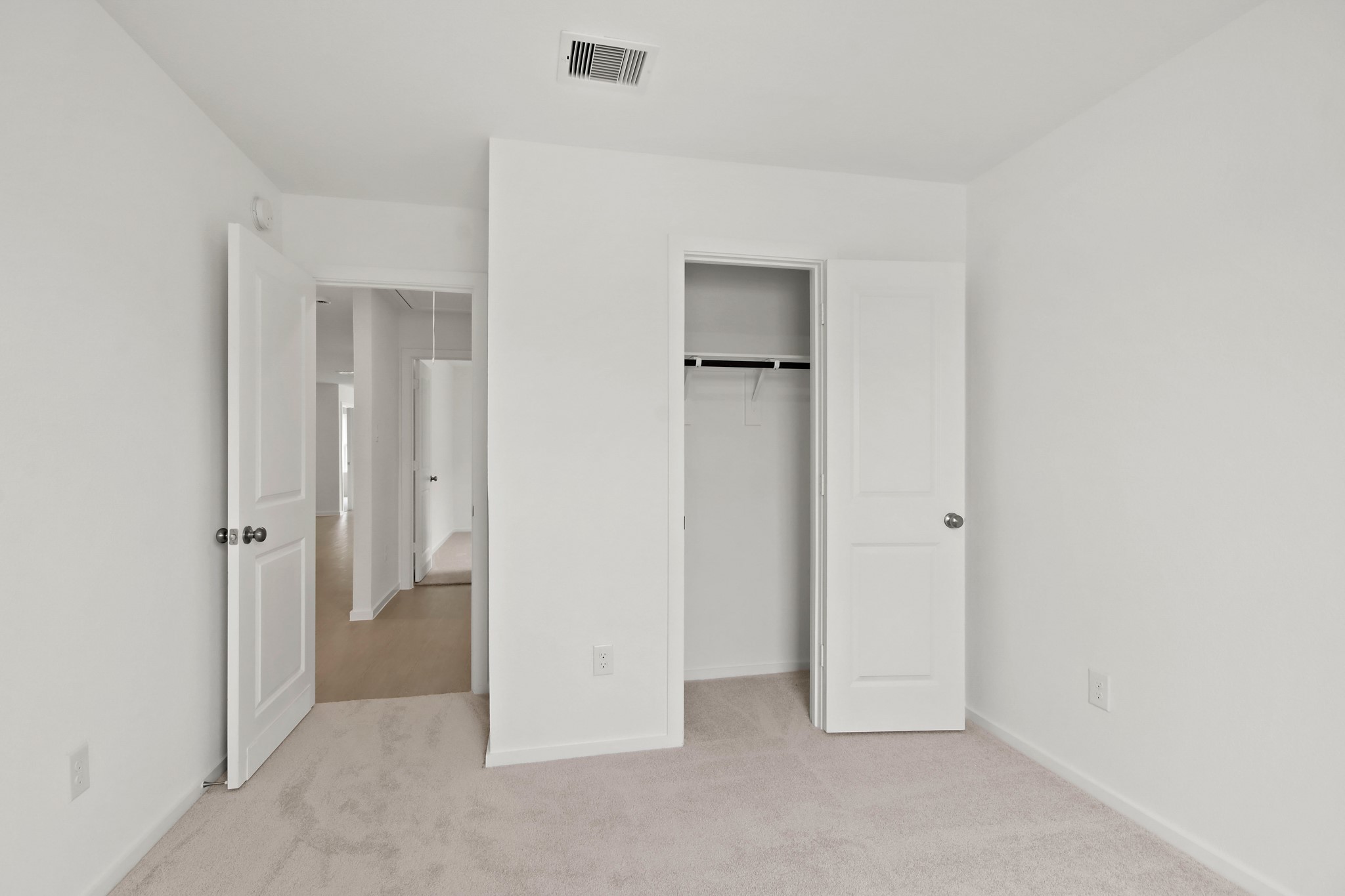 18779 Ribolla Drive New Caney, TX 77357 - Photo 22 of 24 Bright bedroom with neutral walls and carpet.