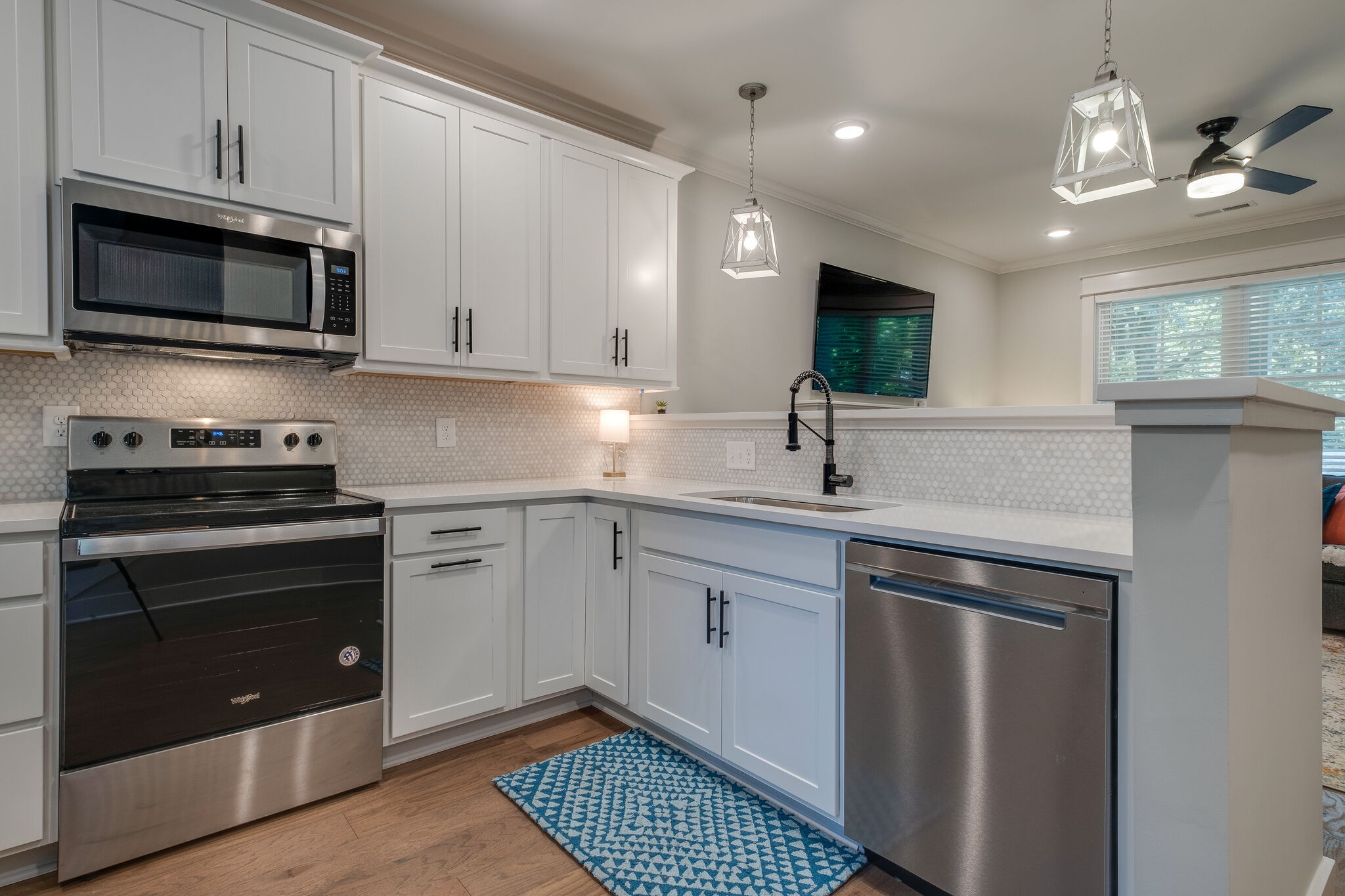 7110 Taylor Road Fairview, TN 37062 - Photo 11 of 31 a kitchen with stainless steel appliances granite countertop a sink and a stove