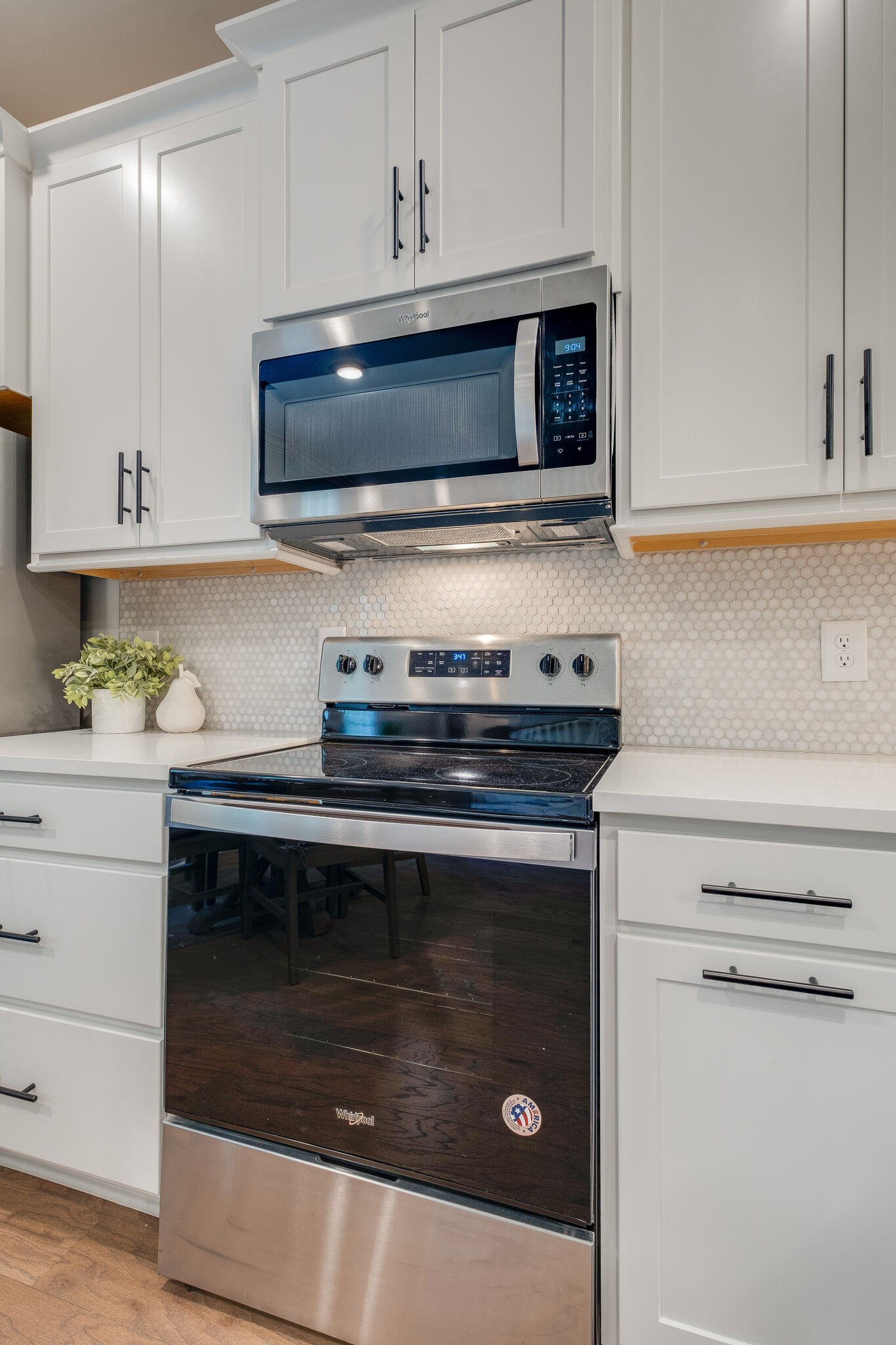 7110 Taylor Road Fairview, TN 37062 - Photo 12 of 31 a kitchen with stainless steel appliances granite countertop a stove microwave and cabinets