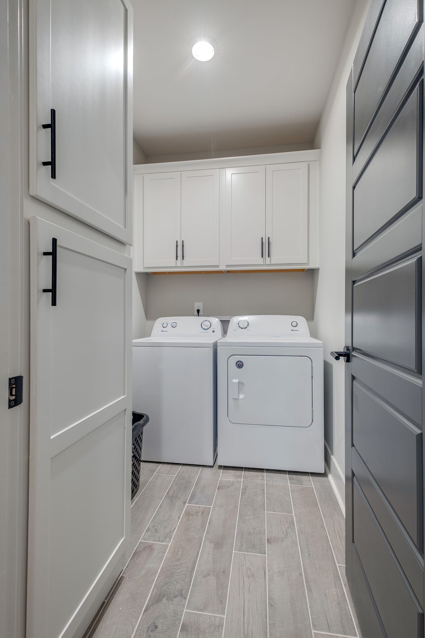 7110 Taylor Road Fairview, TN 37062 - Photo 15 of 31 a utility room with cabinets washer and dryer