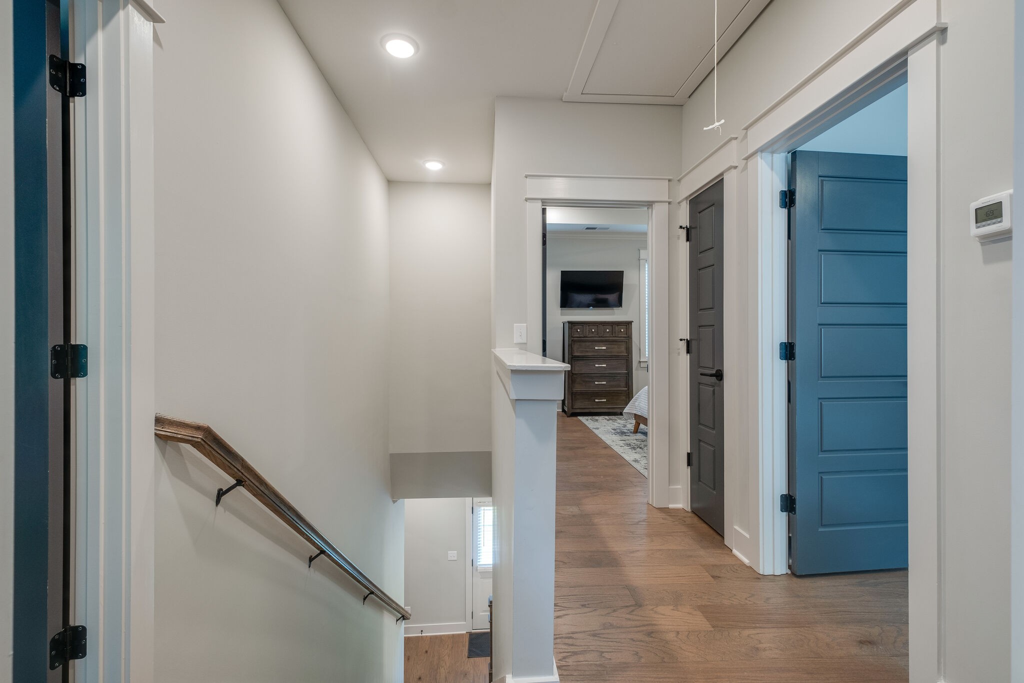 7110 Taylor Road Fairview, TN 37062 - Photo 16 of 31 a view of a hallway with wooden floor and a living room