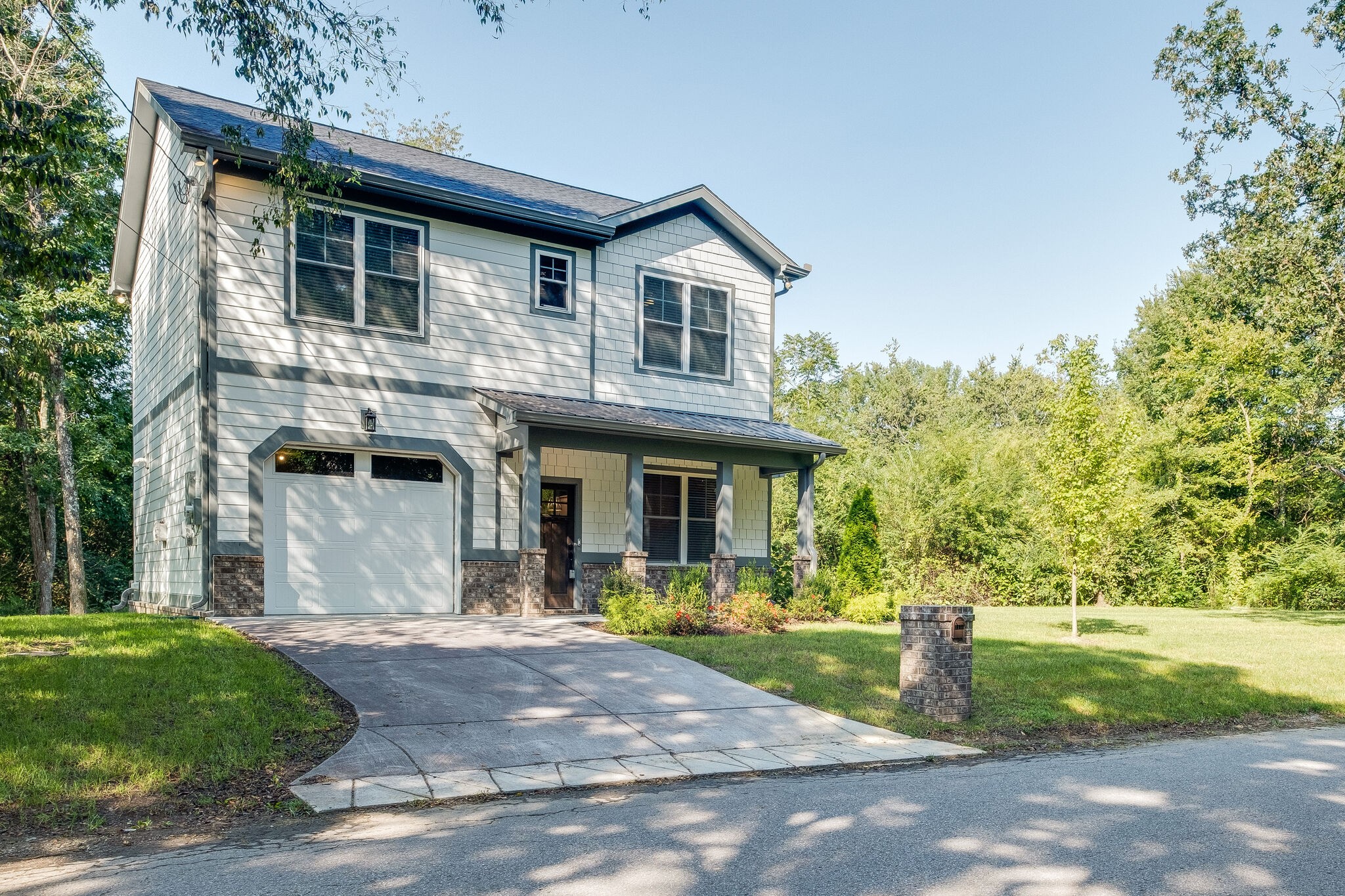 7110 Taylor Road Fairview, TN 37062 - Photo 3 of 31 a front view of a house with garden