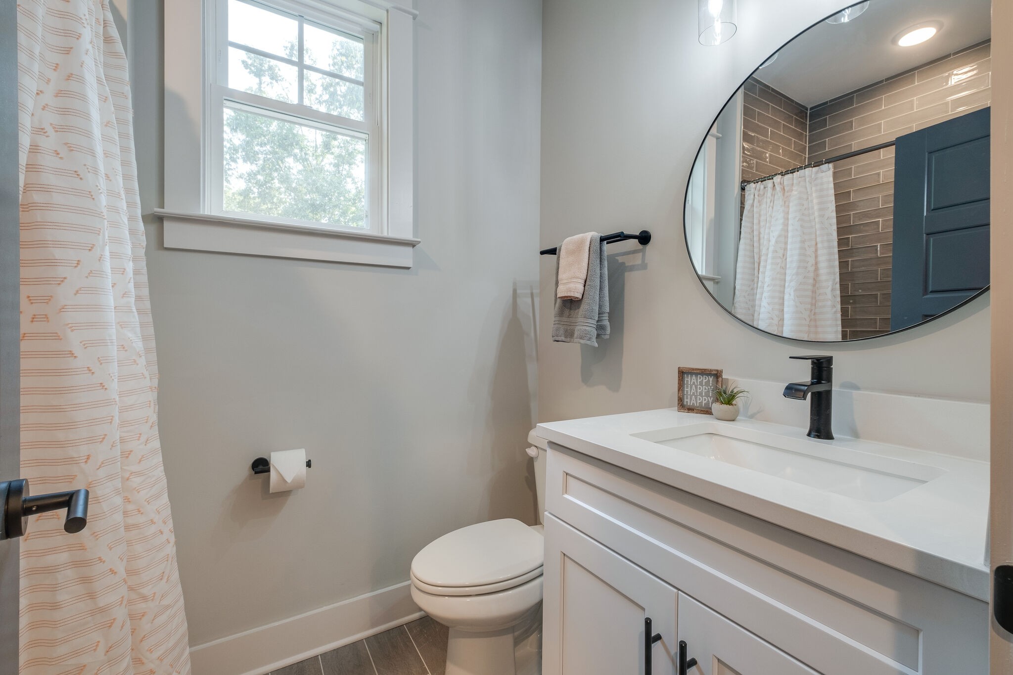 7110 Taylor Road Fairview, TN 37062 - Photo 26 of 31 a bathroom with a sink toilet and mirror