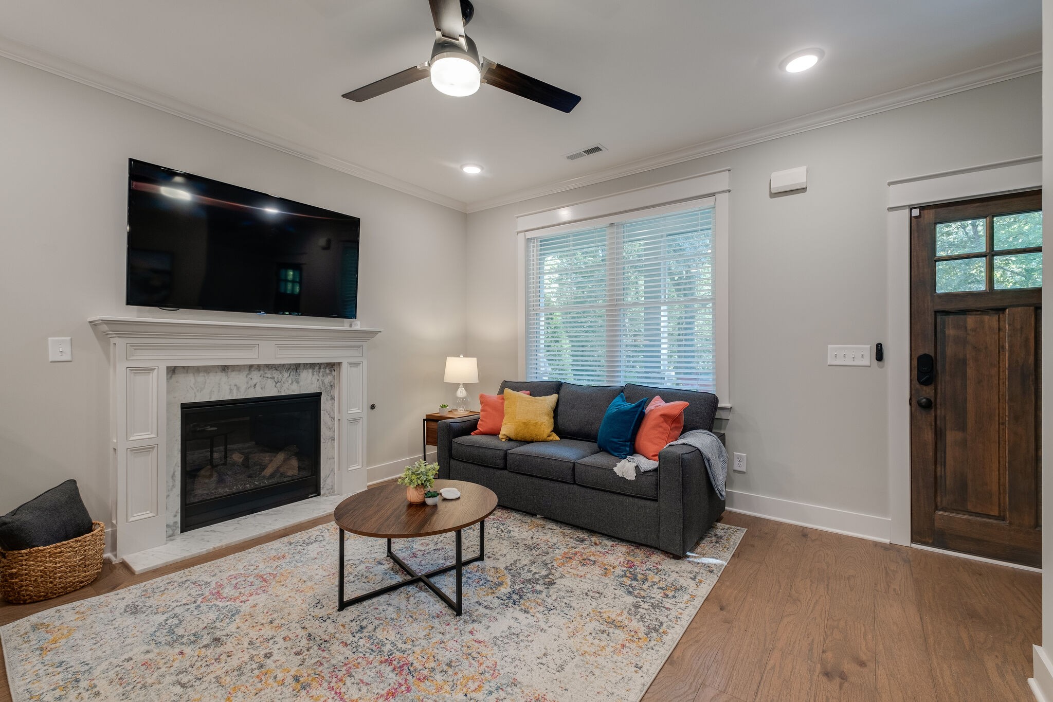 7110 Taylor Road Fairview, TN 37062 - Photo 7 of 31 a living room with furniture a flat screen tv and a fireplace