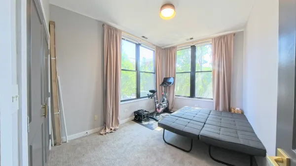 a bed room with a bed and a window