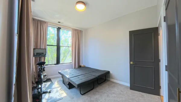 a living room with furniture pool table and a window