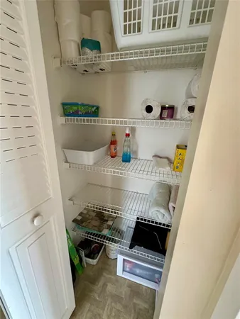 a close view of a sink and dishwasher in a cabinet