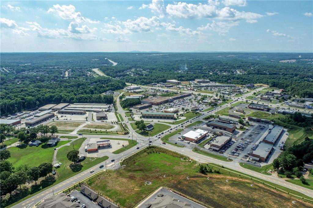 5378 Thompson Mill Road Hoschton, GA 30548 - Photo 13 of 16 an aerial view of residential houses with outdoor space