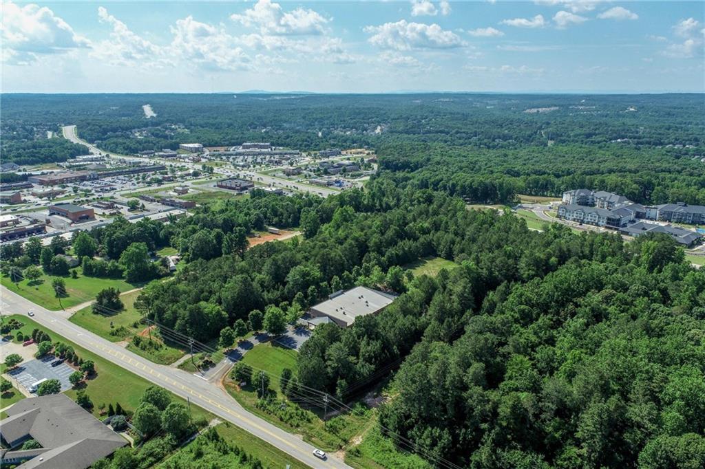 5378 Thompson Mill Road Hoschton, GA 30548 - Photo 6 of 16 an aerial view of residential building and green space