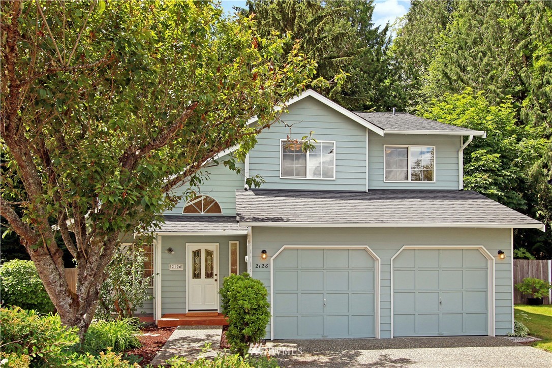 2126 164th Place Southeast Bothell, WA 98012 - Photo 1 of 18 a front view of a house with a garden