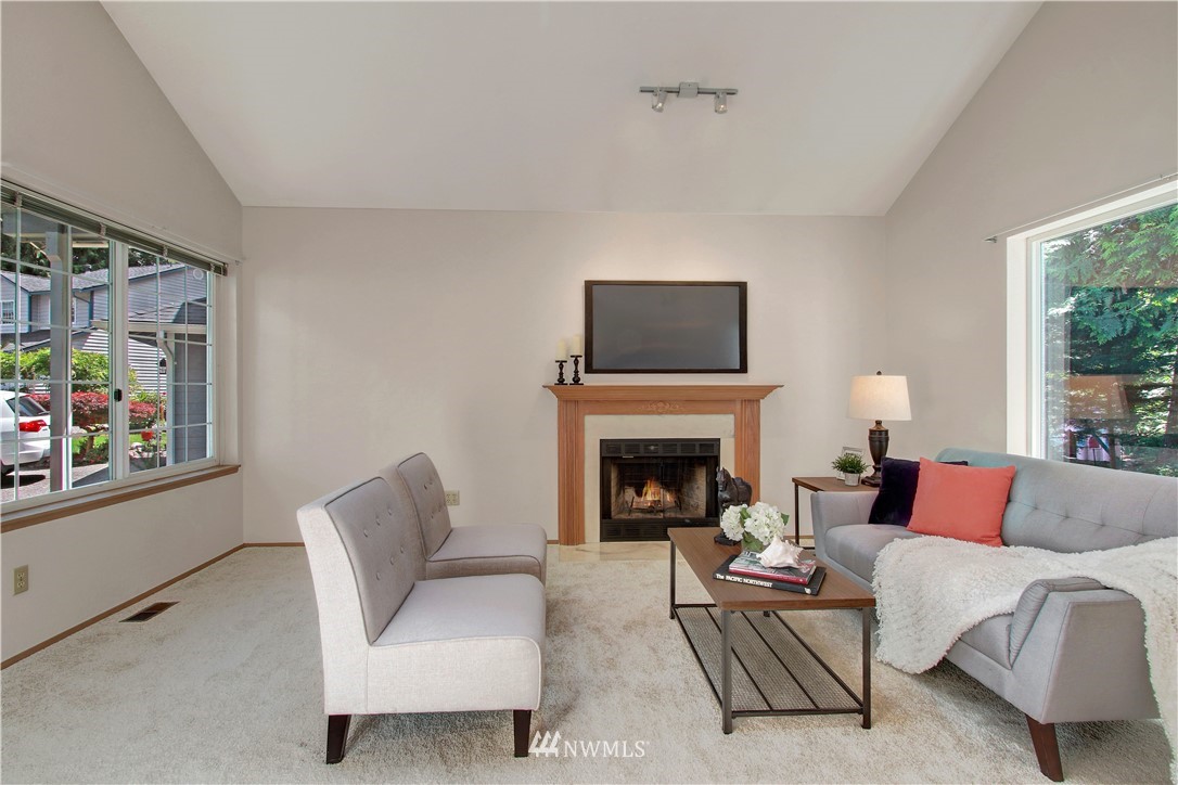 2126 164th Place Southeast Bothell, WA 98012 - Photo 3 of 18 a living room with furniture and a fireplace