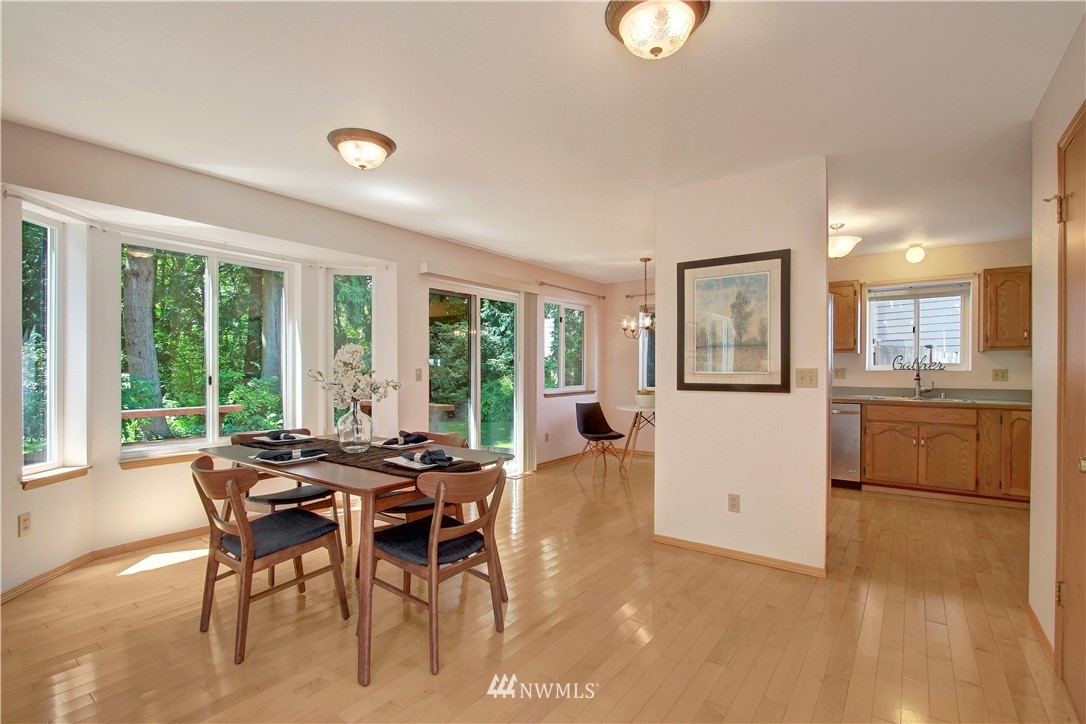 2126 164th Place Southeast Bothell, WA 98012 - Photo 4 of 18 a view of a dining room with furniture window and outside view