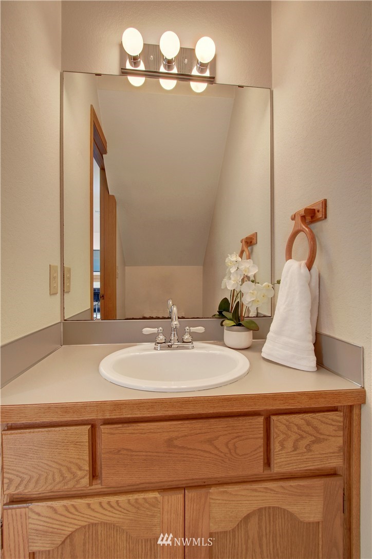2126 164th Place Southeast Bothell, WA 98012 - Photo 8 of 18 a bathroom with a sink and a mirror