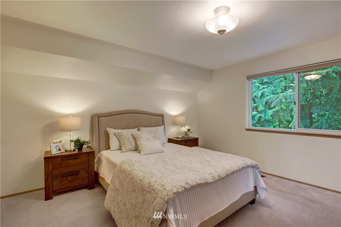 2126 164th Place Southeast Bothell, WA 98012 - Photo 9 of 18 a bedroom with a bed and a night stand