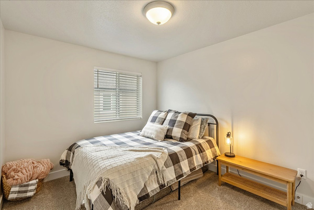 287 North 100th West Morgan, UT 84050 - Photo 19 of 27 Carpeted bedroom featuring baseboards