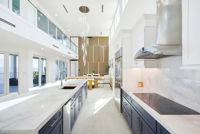 a view of a hallway with wooden floor and furniture