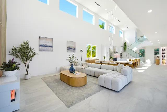 a balcony with table and chairs