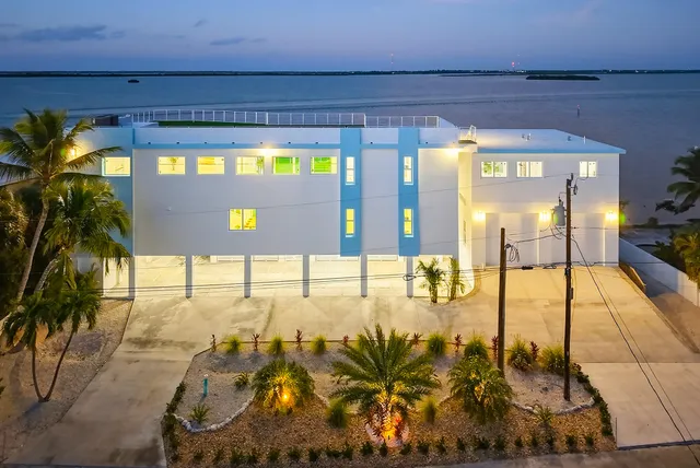 a view of a living room with furniture and a chandelier