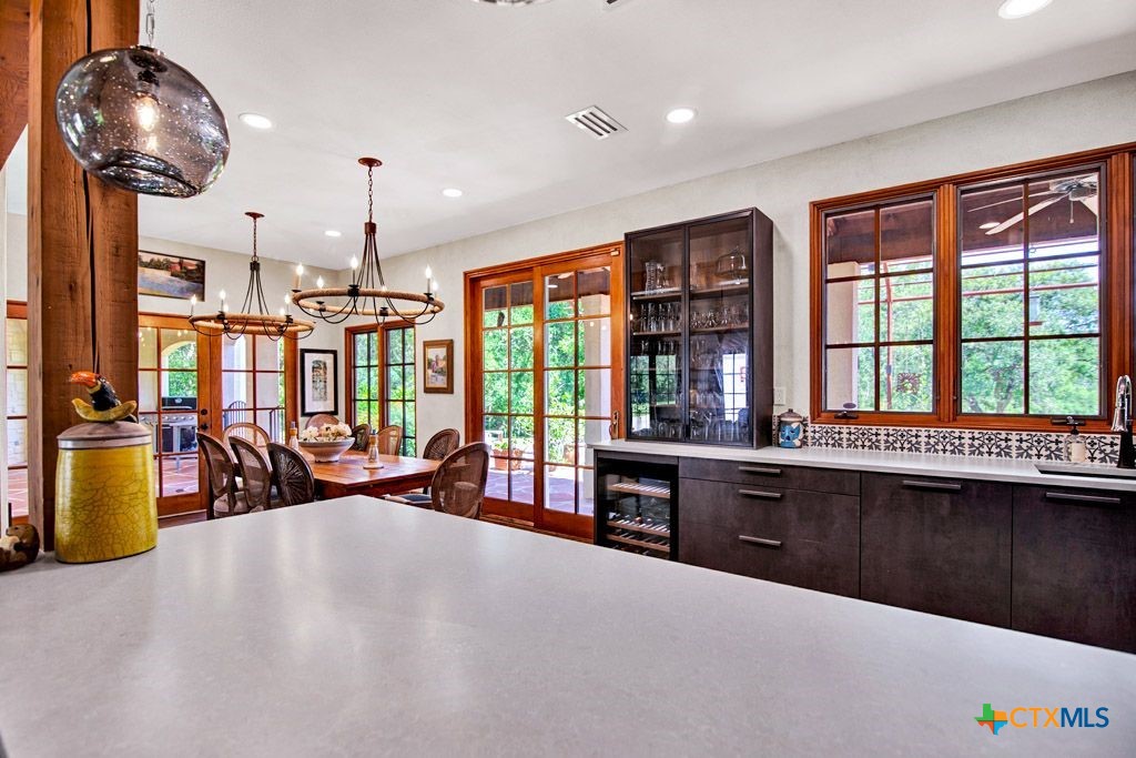 541 Martindale Falls Road Martindale, TX 78655 - Photo 15 of 44 a large kitchen with a table and chairs