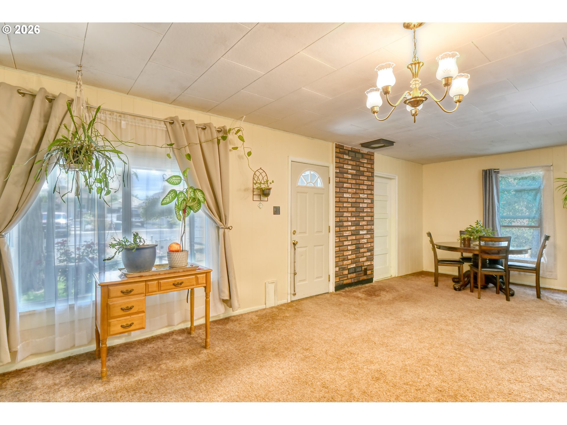 237 Southwest 2nd Street Pilot Rock, OR 97868 - Photo 6 of 34 a dining room with furniture and a chandelier