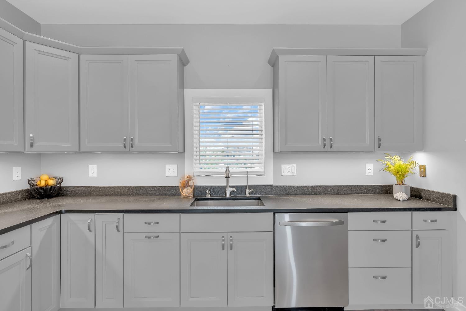 629 Front Street Union Beach, NJ 07735 - Photo 13 of 63 a kitchen with granite countertop white cabinets white appliances and a sink