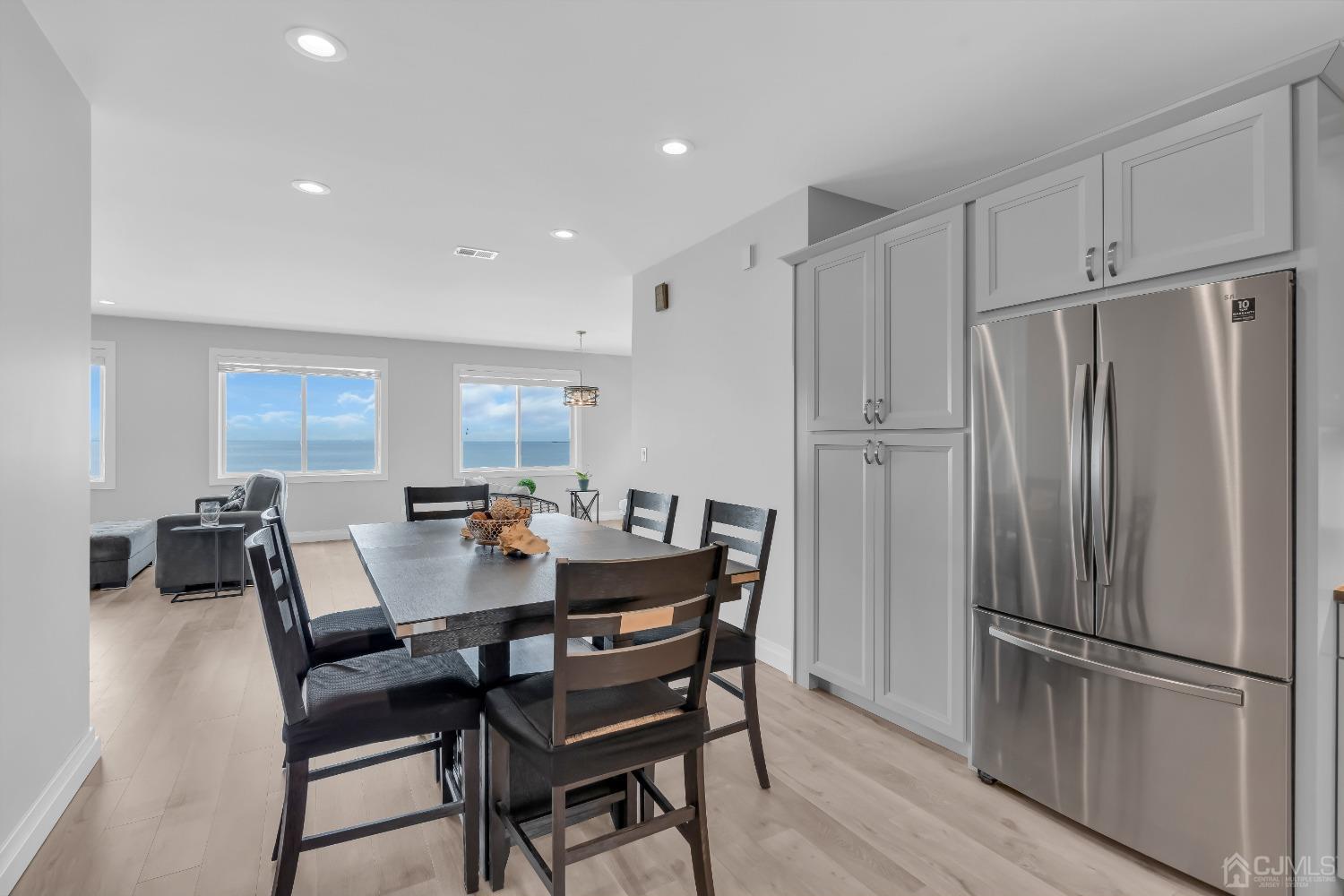 629 Front Street Union Beach, NJ 07735 - Photo 15 of 63 a dining room with furniture and wooden floor