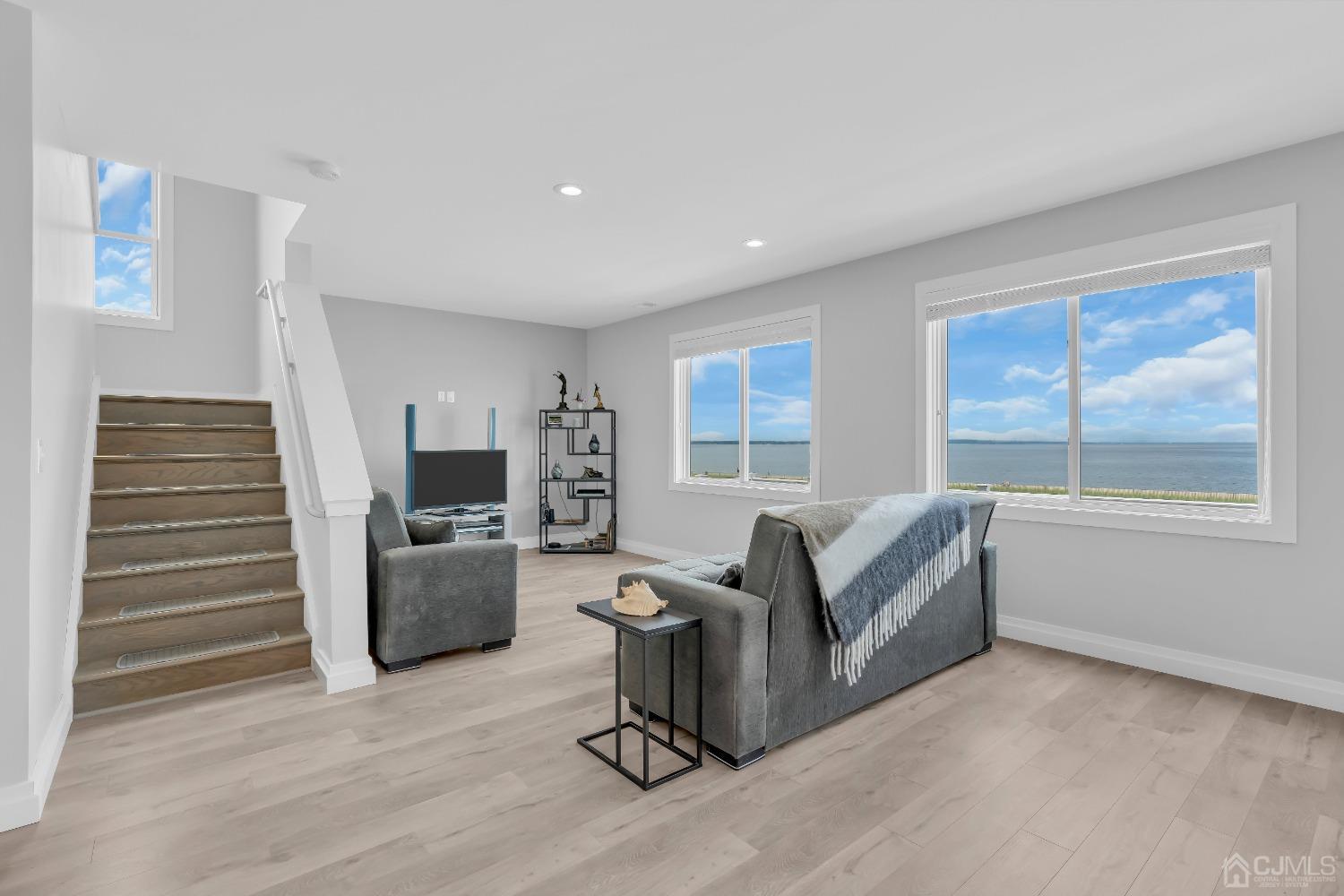 629 Front Street Union Beach, NJ 07735 - Photo 16 of 63 a living room with furniture and a flat screen tv