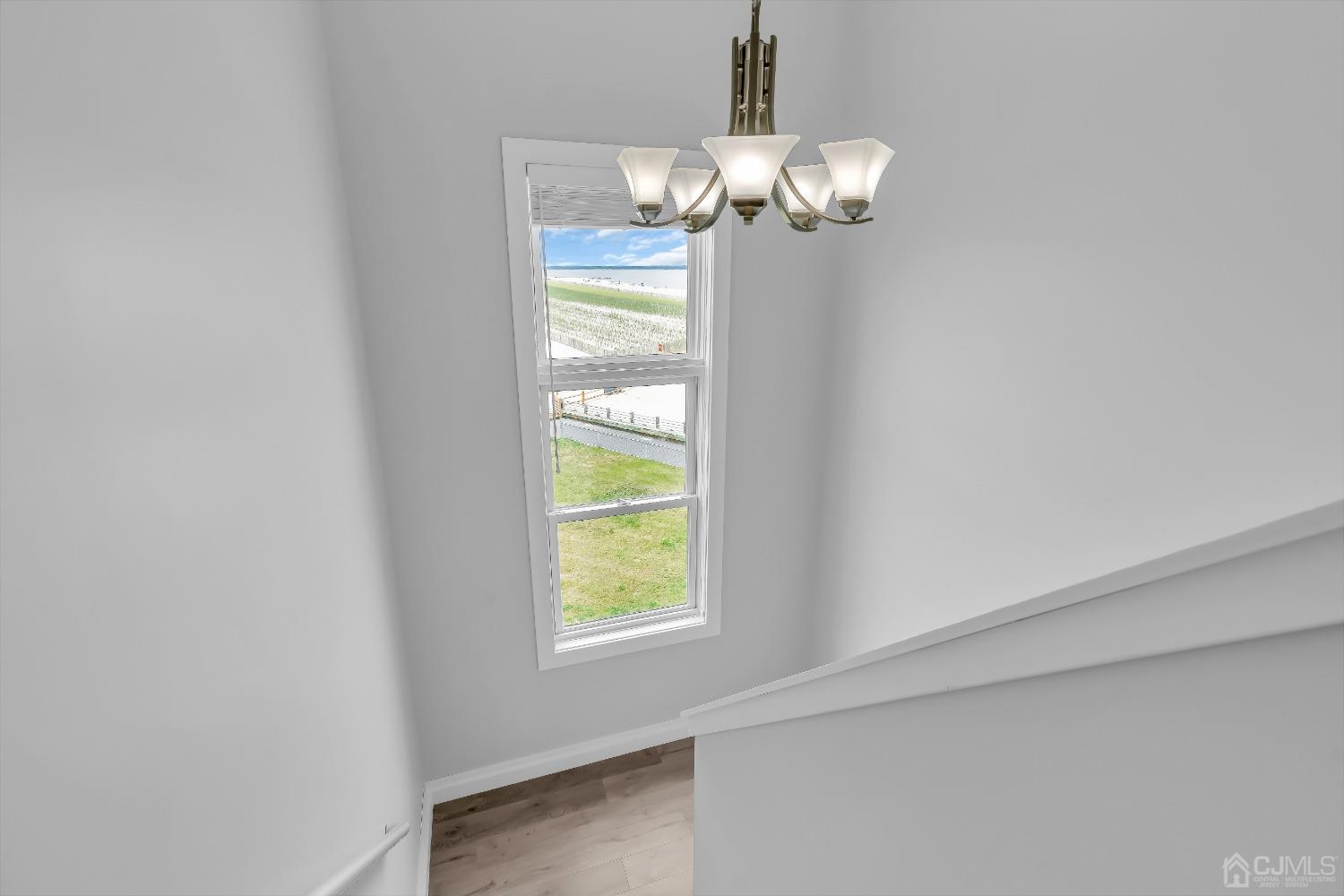 629 Front Street Union Beach, NJ 07735 - Photo 20 of 63 a dining room with chandelier and window