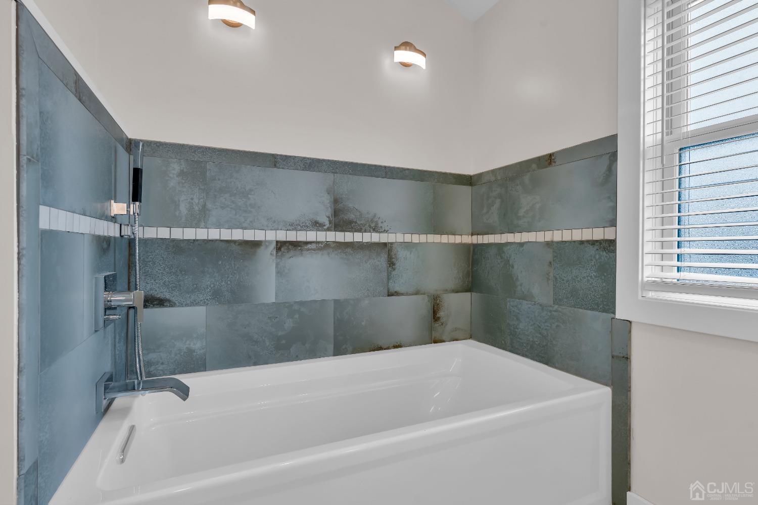 629 Front Street Union Beach, NJ 07735 - Photo 24 of 63 a bathroom with a bathtub