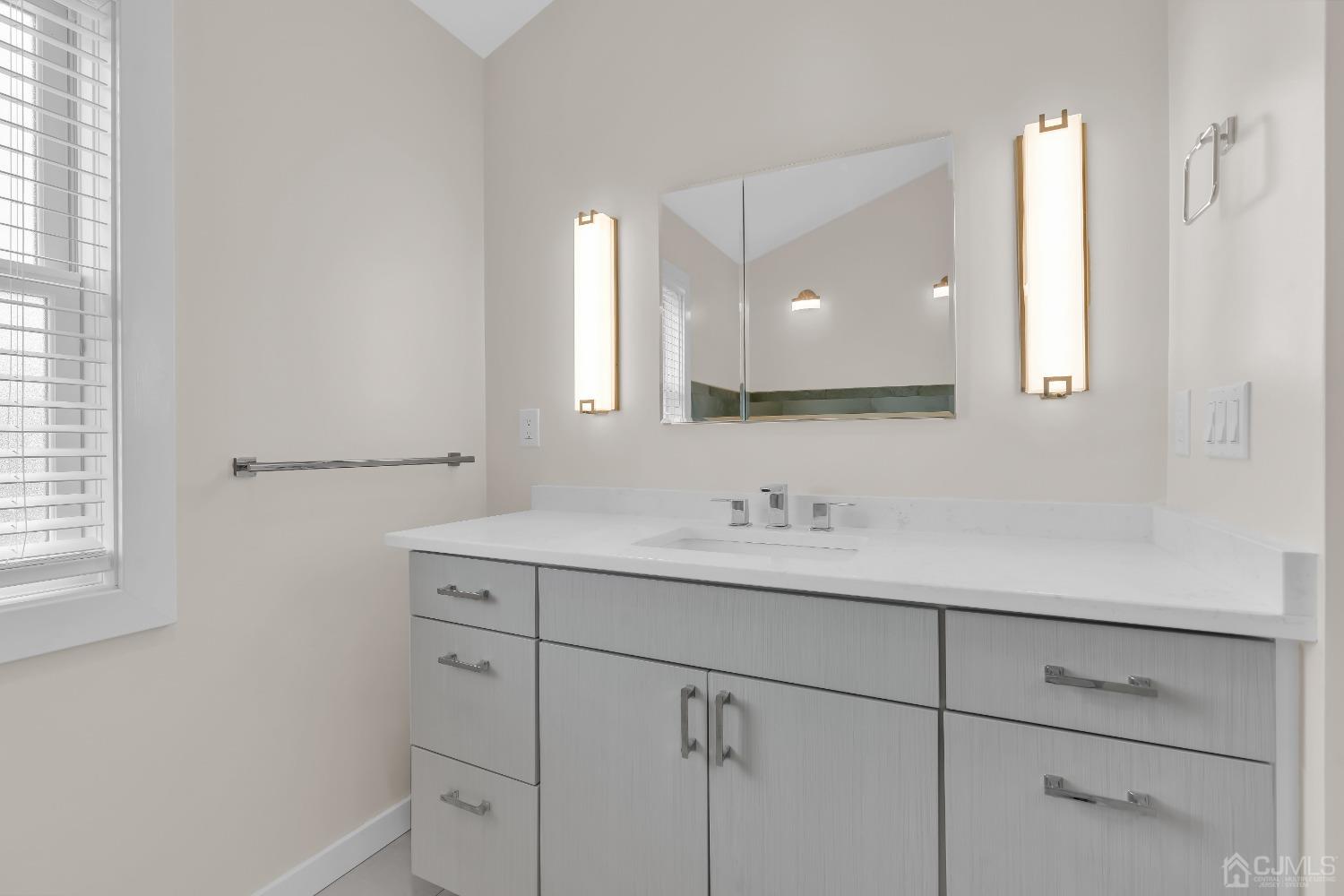 629 Front Street Union Beach, NJ 07735 - Photo 26 of 63 a bathroom with a sink and a mirror