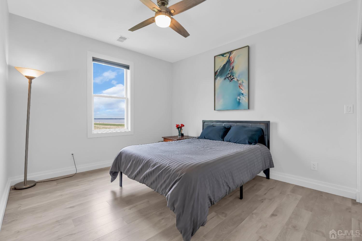 629 Front Street Union Beach, NJ 07735 - Photo 30 of 63 a bedroom with a bed and a window