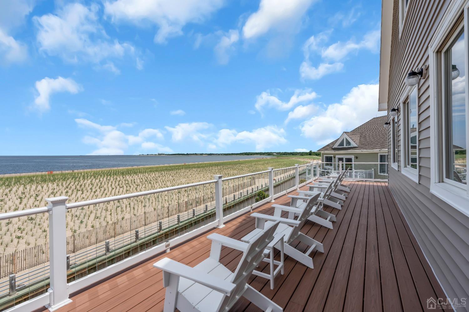 629 Front Street Union Beach, NJ 07735 - Photo 36 of 63 a view of balcony with wooden floor and ocean view