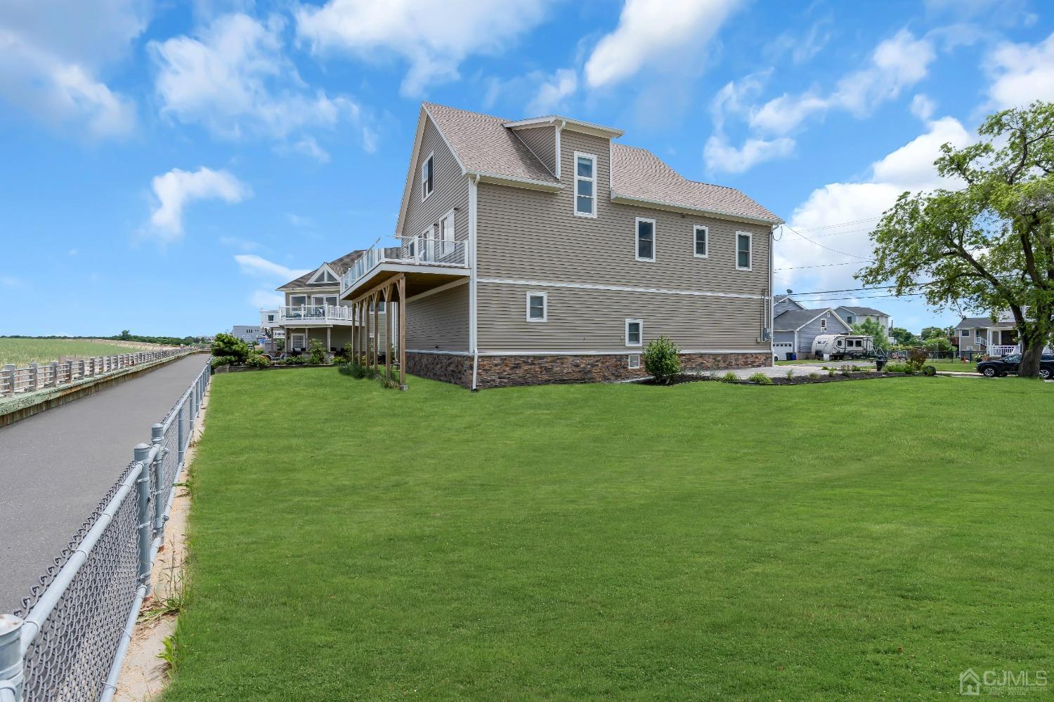 629 Front Street Union Beach, NJ 07735 - Photo 39 of 63 a front view of house with yard