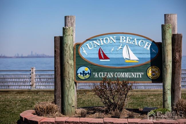 629 Front Street Union Beach, NJ 07735 - Photo 60 of 63 a sign on the side of a building