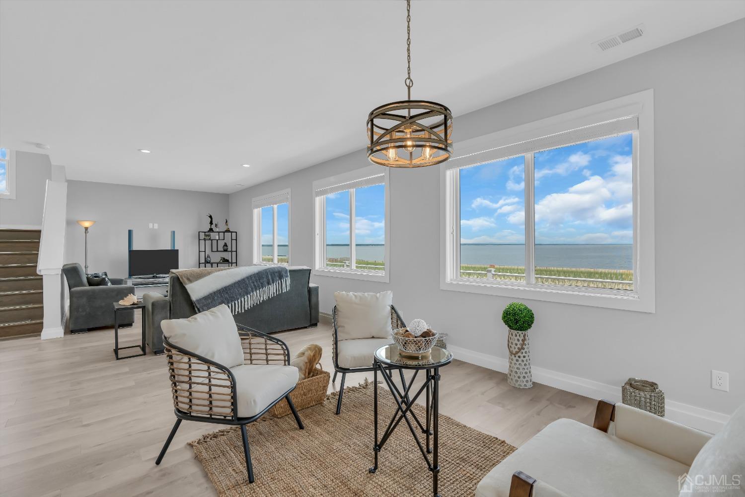 629 Front Street Union Beach, NJ 07735 - Photo 9 of 63 a living room with furniture a window and wooden floor
