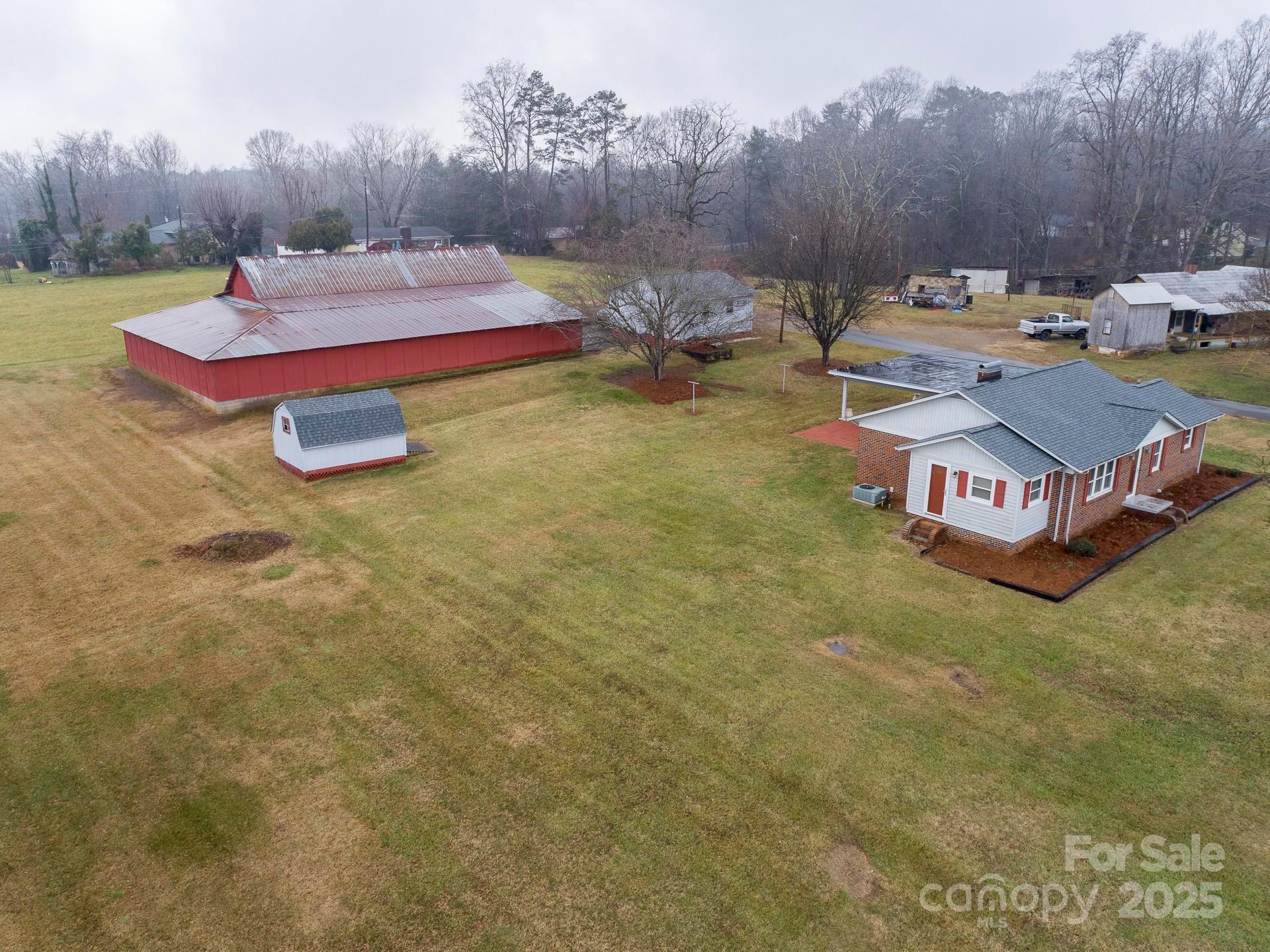 4267 Lower Cedar Valley Road Hudson, NC 28638 - Photo 5 of 45 a view of a swimming pool with lounge chairs