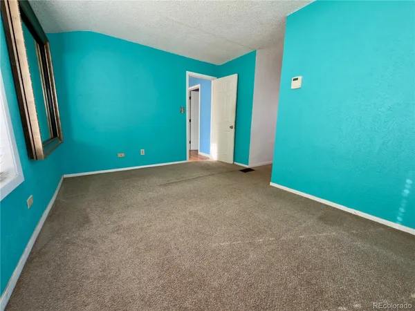 a view of a hallway with a window