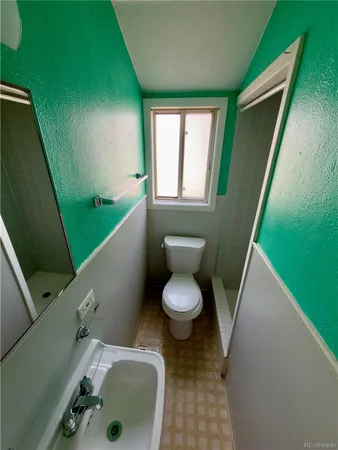 a view of a roof deck with table and chairs with wooden floor