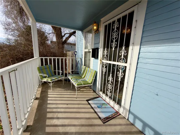 a view of deck with chairs and wooden floor
