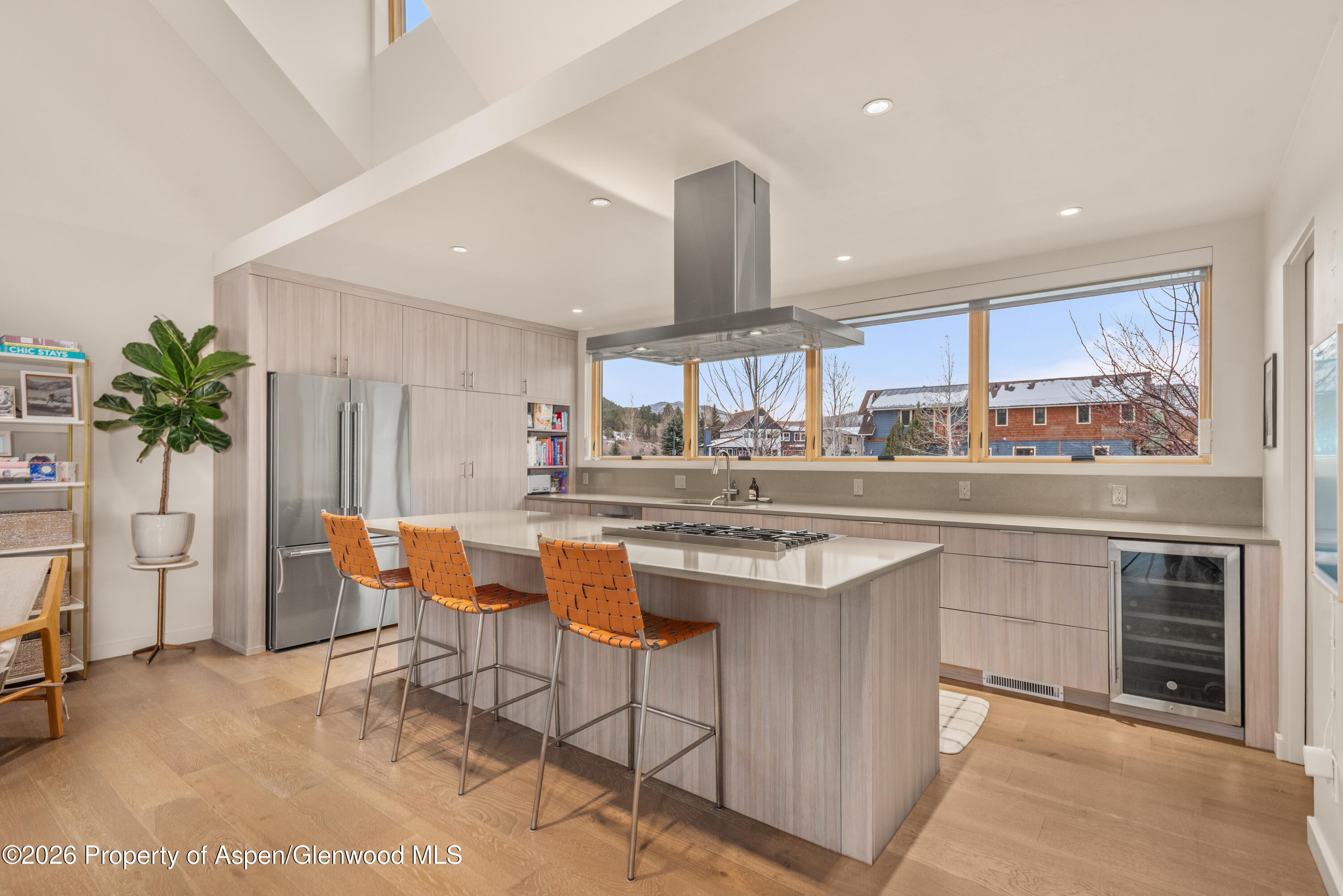113 Valley Court Basalt, CO 81621 - Photo 12 of 33 a kitchen with stainless steel appliances a table and chairs in it