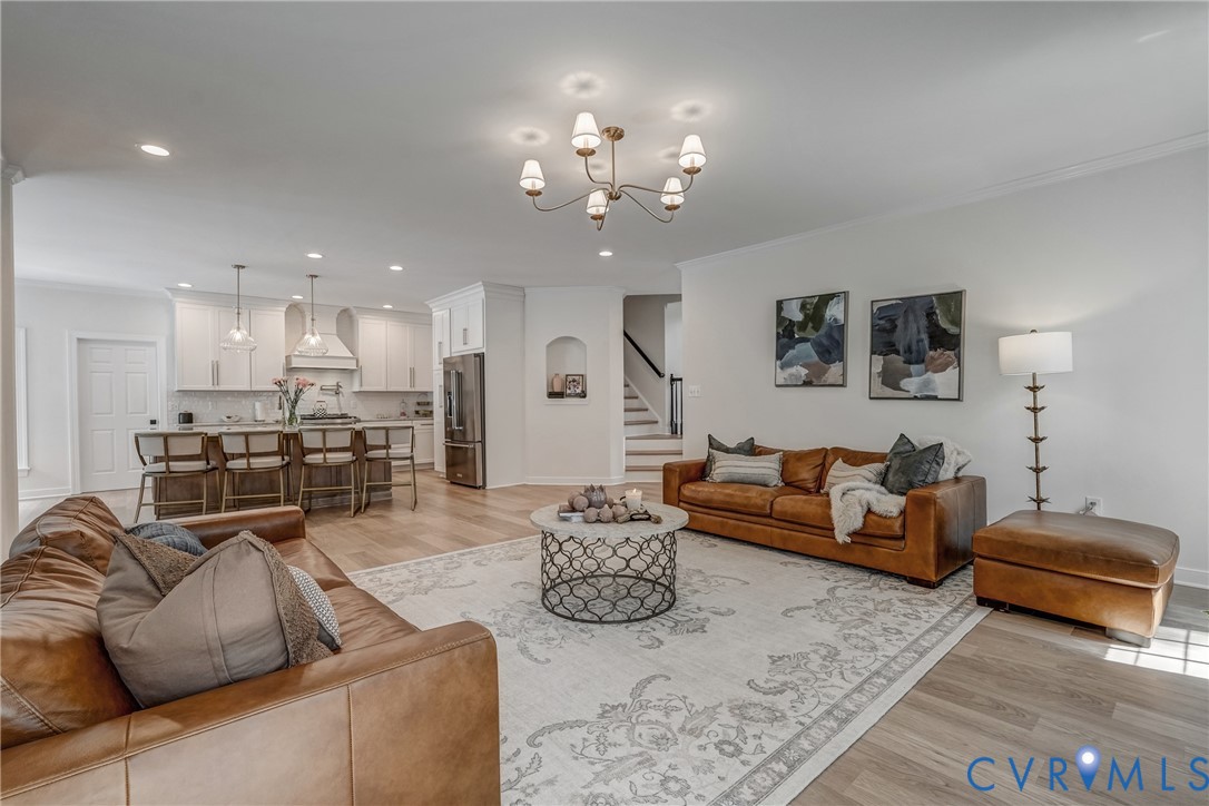 2306 Founders Bridge Road Midlothian, VA 23113 - Photo 14 of 50 a living room with furniture a couch and a chandelier