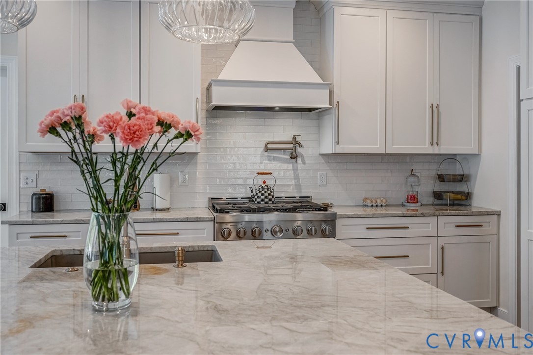 2306 Founders Bridge Road Midlothian, VA 23113 - Photo 19 of 50 a kitchen with stainless steel appliances granite countertop a white cabinets and a stove