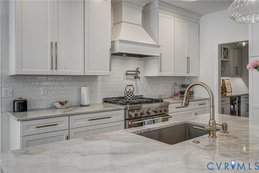 2306 Founders Bridge Road Midlothian, VA 23113 - Photo 21 of 50 a kitchen with stainless steel appliances granite countertop a stove and a white cabinets