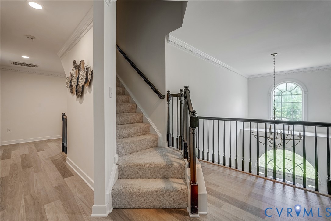 2306 Founders Bridge Road Midlothian, VA 23113 - Photo 26 of 50 a view of staircase with railing and a chandelier