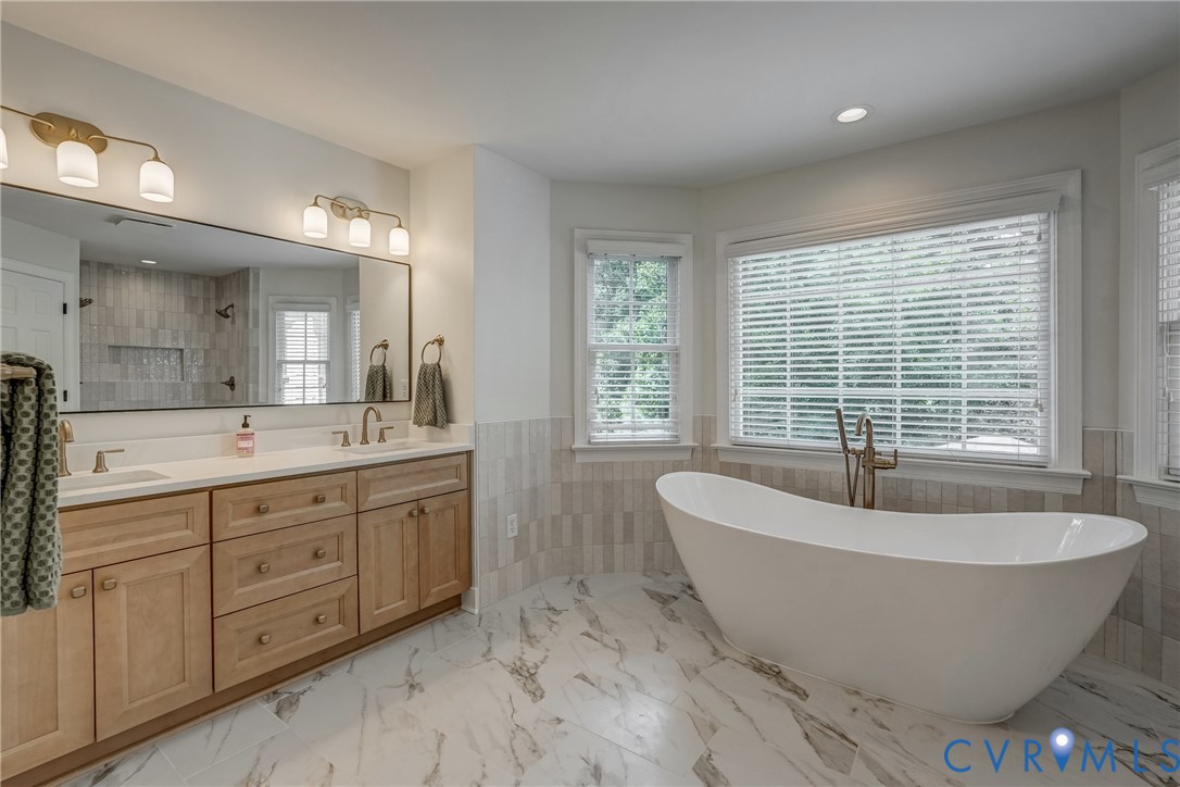 2306 Founders Bridge Road Midlothian, VA 23113 - Photo 32 of 50 a spacious bathroom with a large tub and sink